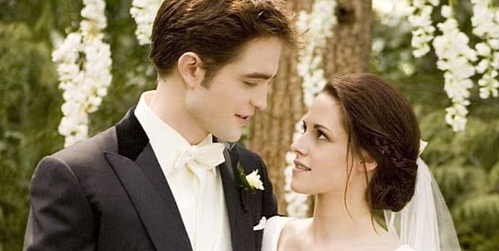 Bella and Edward smile at each other during their wedding