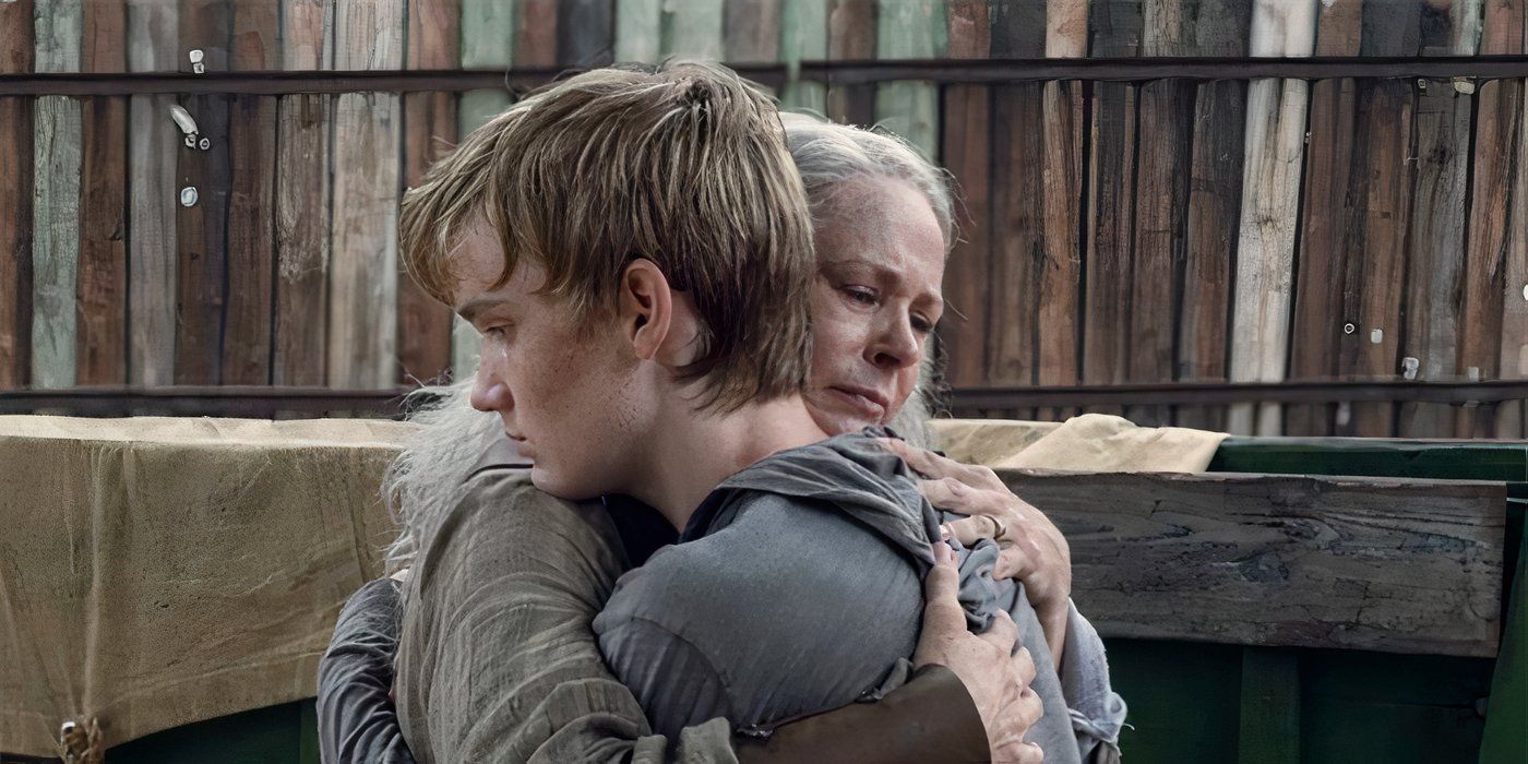 Carol and Henry in an embrace on The Walking Dead