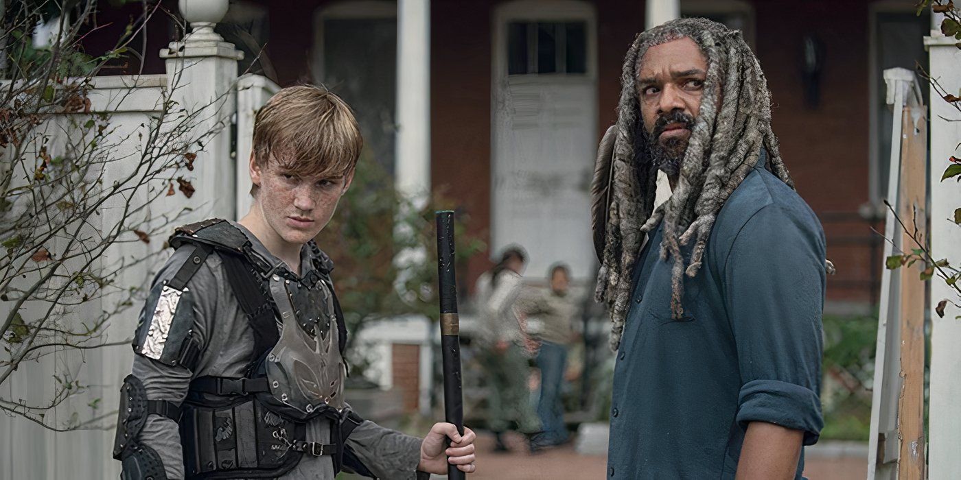 Henry and Ezekiel standing together, both looking at something on The Walking Dead