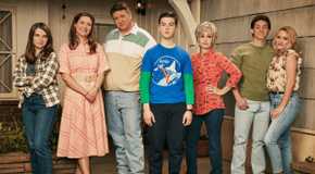 Young Sheldon cast pose together in front of the Cooper househould