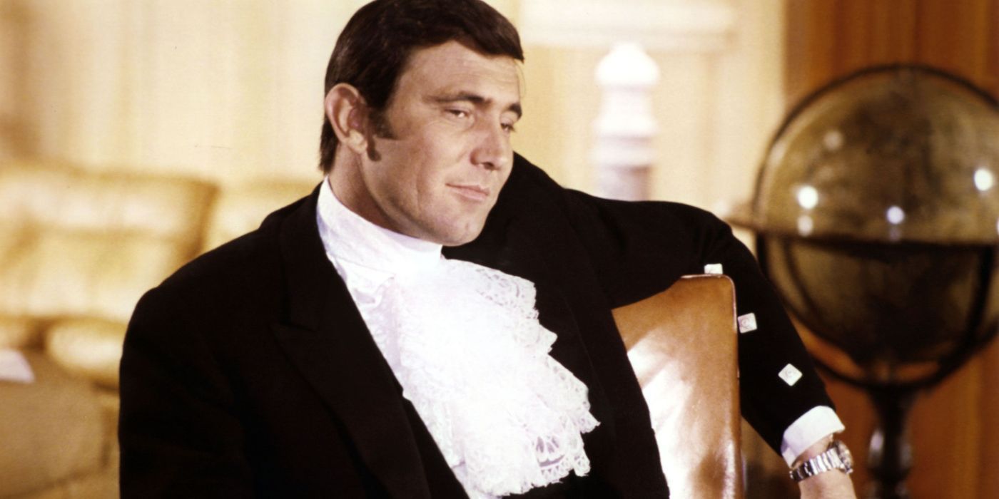 George Lazenby as James Bond sitting comfortably in a chair