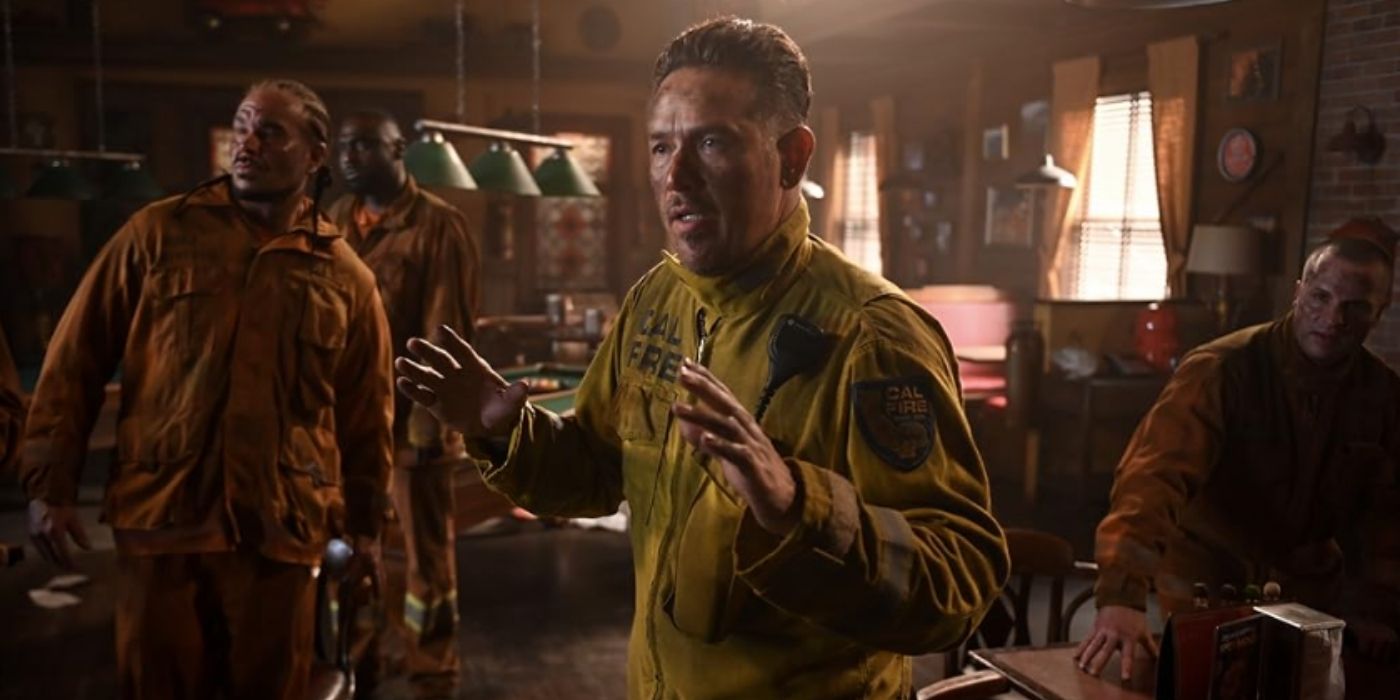 Kevin Alejandro as Manny Perez stands with inmates in a bar on Fire Country