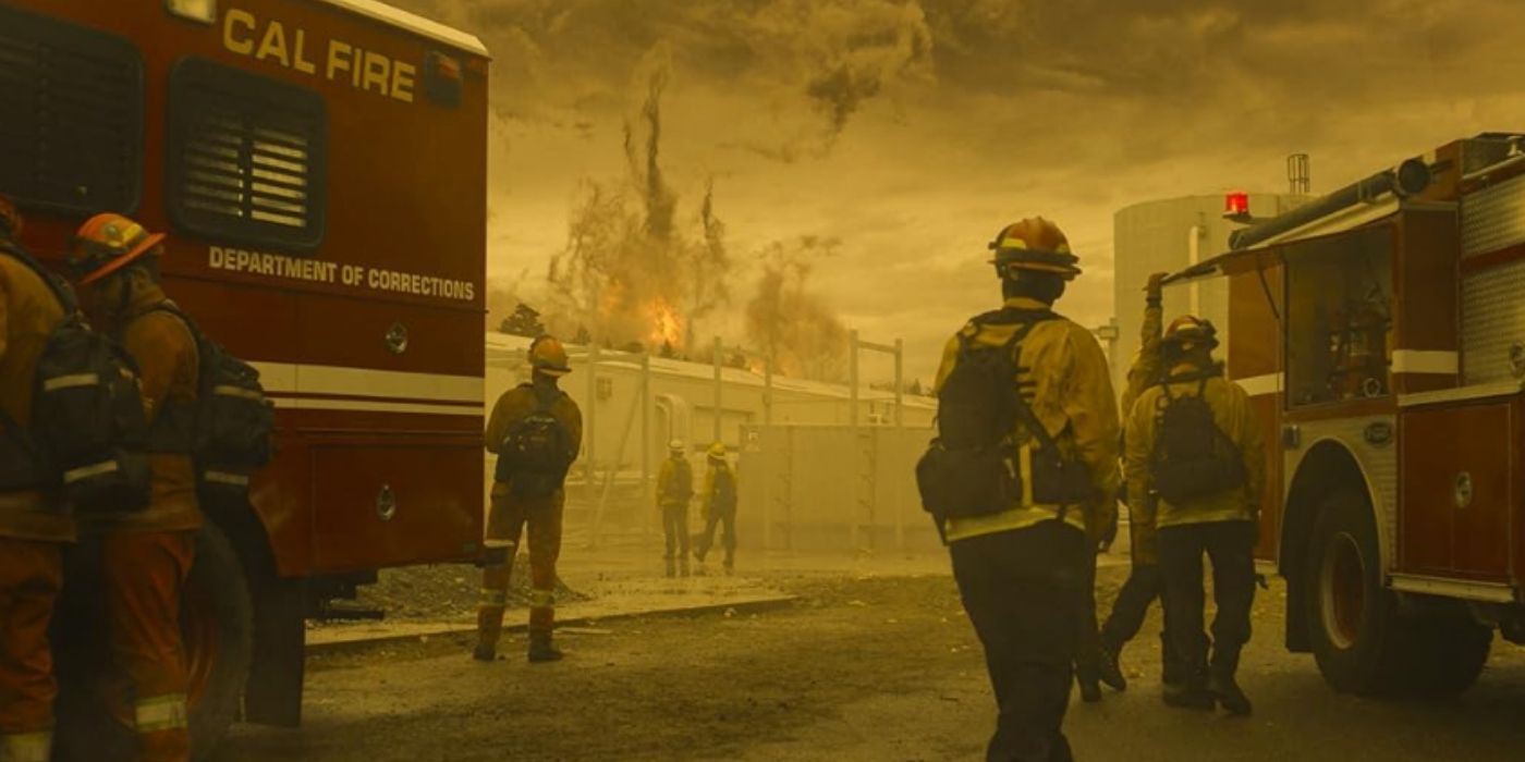 Several Cal Fire Firefighters watch as a tornado develops on Fire Country