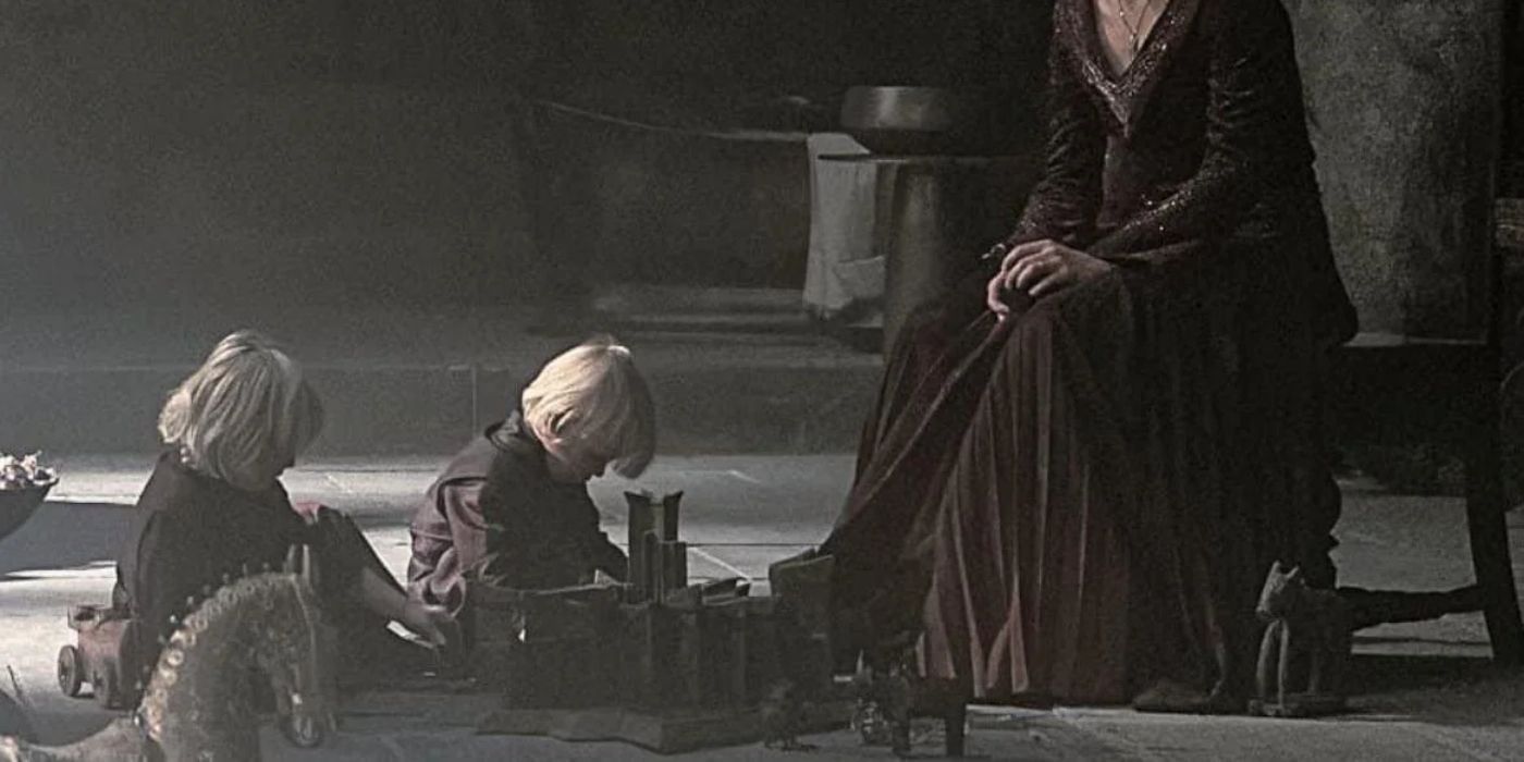 Aegon and Viserys playing on the floor in House of the Dragon.