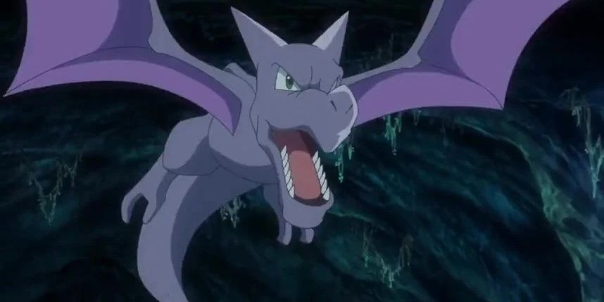 An aerodactyl flies into a cave.