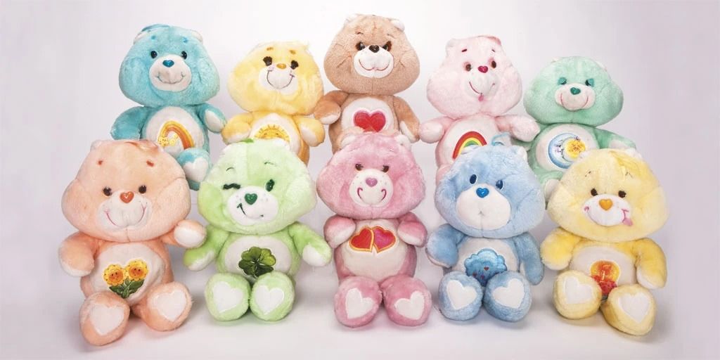 A collection of Care Bear plush toys