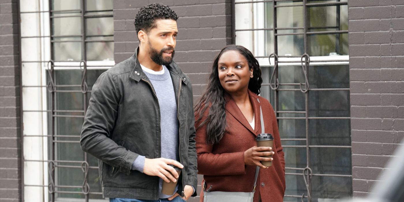 Loren and Maggie (Henderson Wade and Marlyne Barrett) walk down a street with coffee on Chicago Med