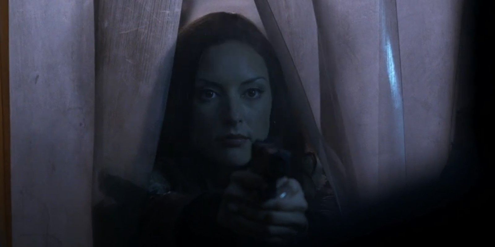 Elle Greenway raises her weapons at Oley during an arrest in the "Blood Hunger" episode of Criminal Minds