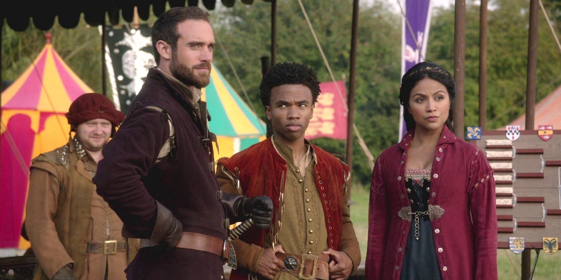 Galavant, Sid and Isabella standing in front of a table in galavant.