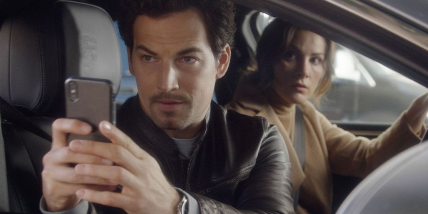 Giacomo Gianniotti as Andrew DeLuca takes a photo in his phone while in a car with Stefania Spampinato as Carina DeLuca on Station 19