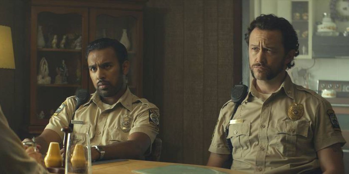 Police officers Will and Terry (Himesh Patel, Joseph Gordon-Levitt) sit at a table in Greedy People