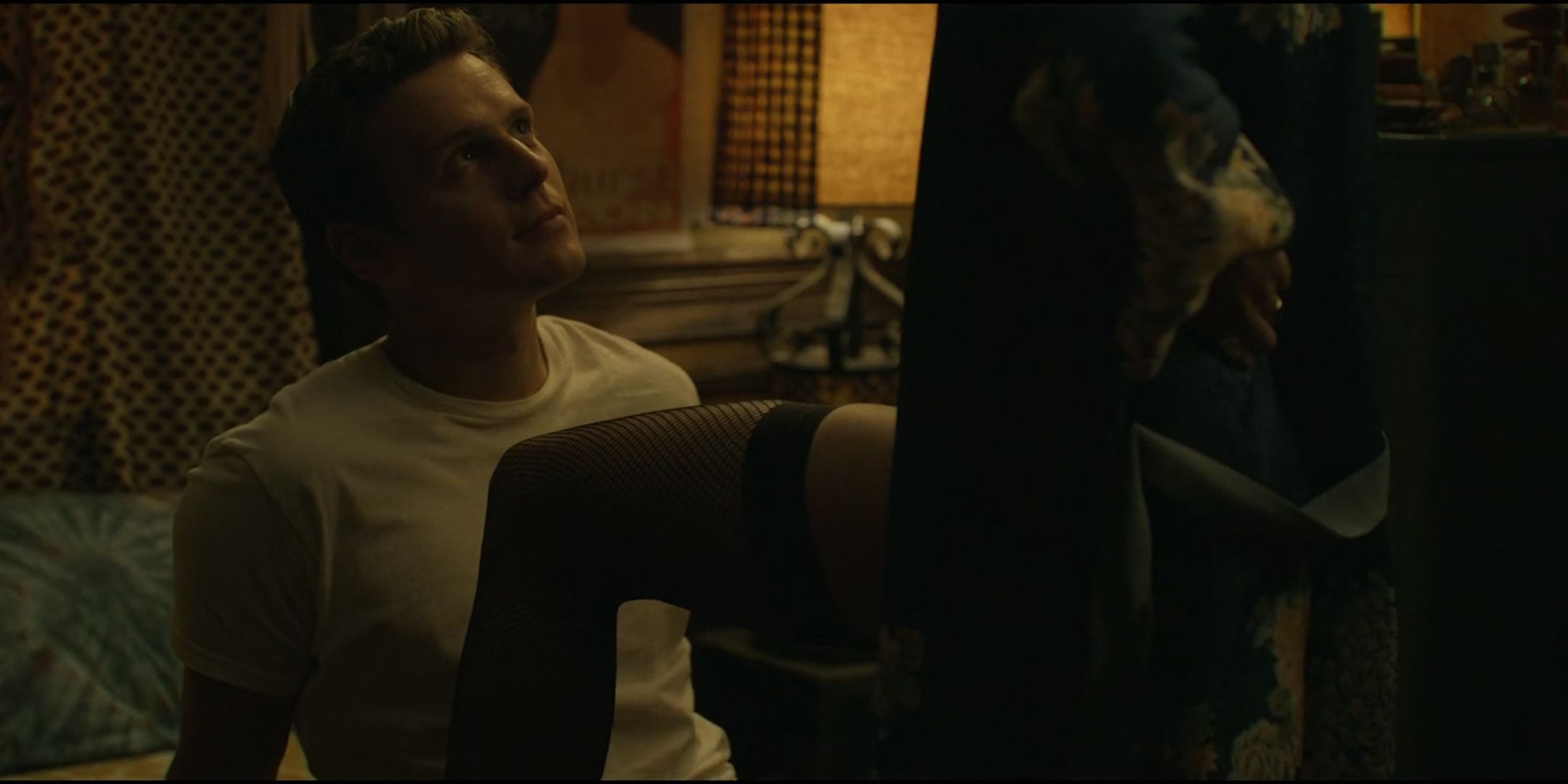 Hannah Gross as Debbie Mitford puts her leg up on Jonathan Groff as Holden Ford with fishnets on in Mindhunter