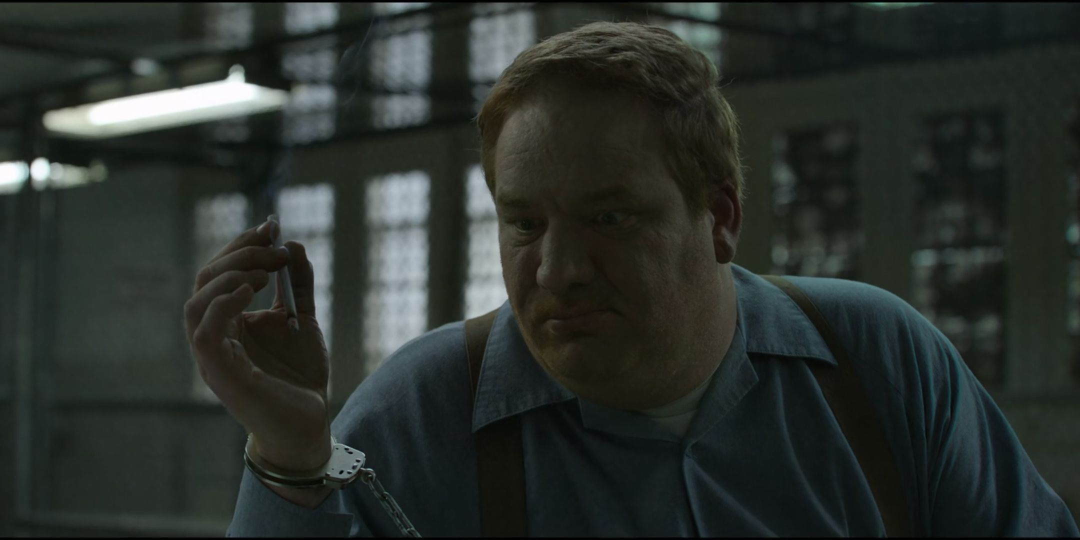 Happy Anderson as Jerry Brudos holds a cigarette in Mindhunter