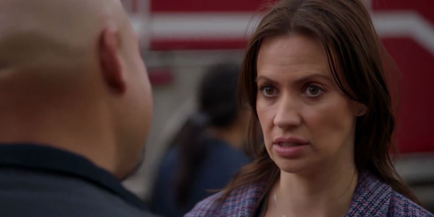 Joe Miñoso as Joe Cruz faces away from the camera speaking to Kristen Gutoskie as Chloe Cruz on Chicago Fire