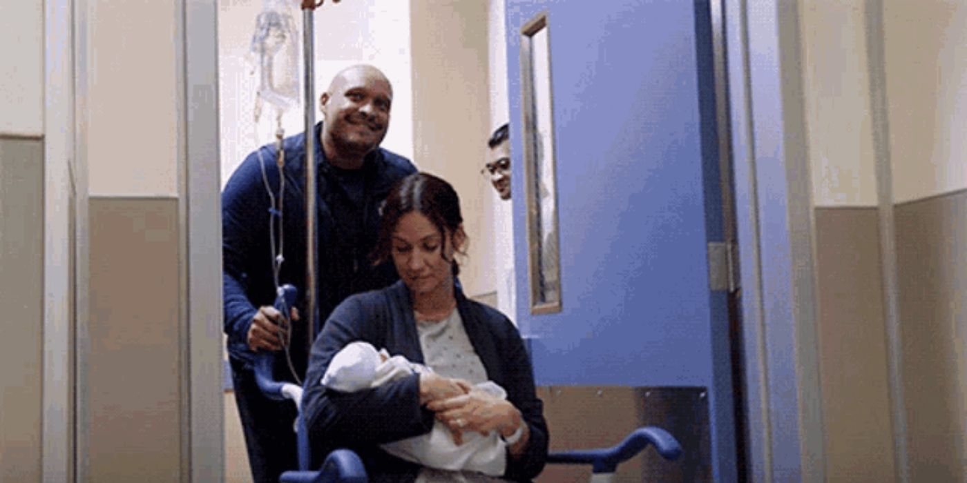 Joe Miñoso as Joe Cruz pushes Kristen Gutoskie as Chloe Cruz in a wheelchair while she holds their newborn son on Chicago Fire