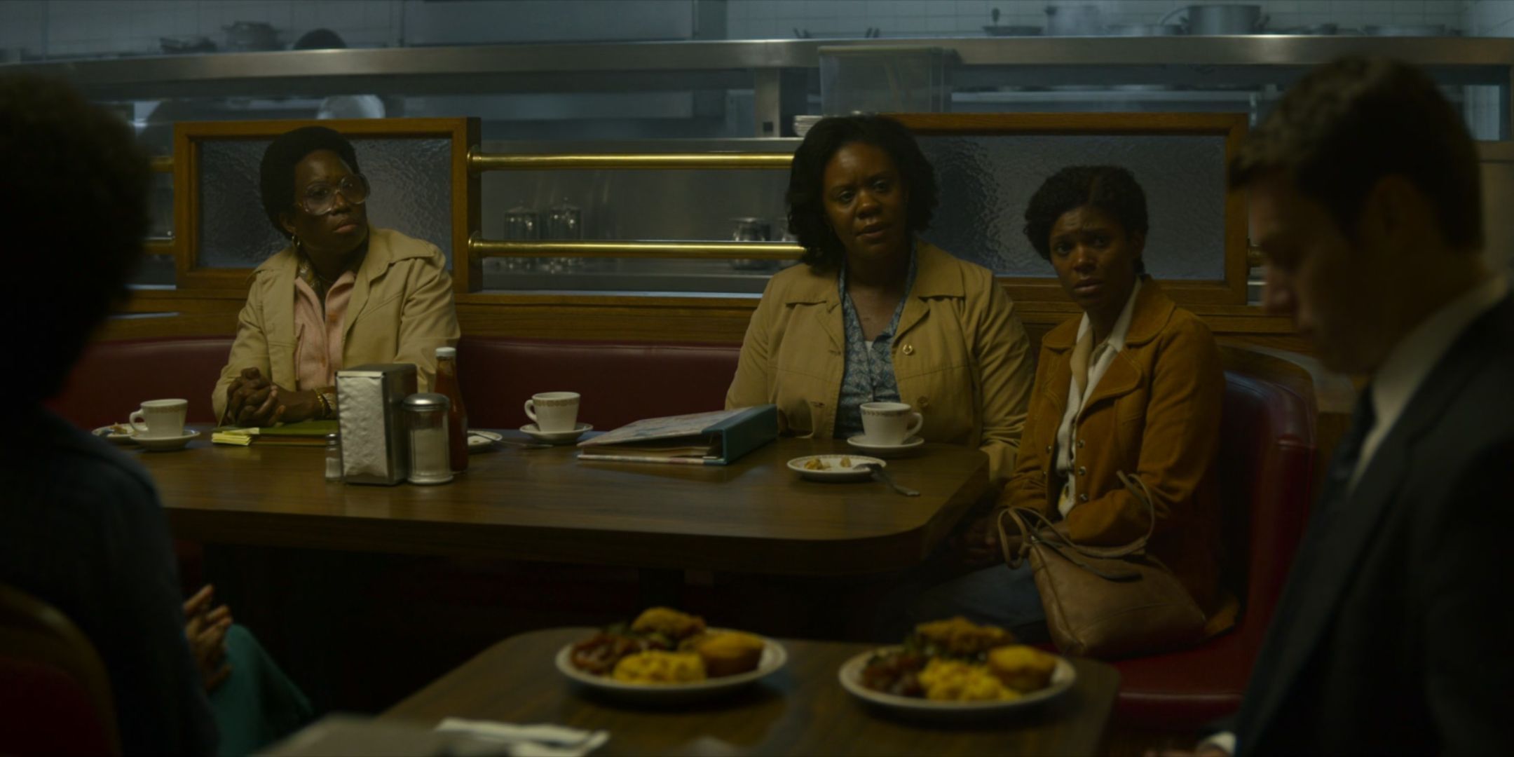 Jonathan Groff as Holden Ford talks to a group of black mothers including June Carryl as Camille Bell in Atlanta in Mindhunter