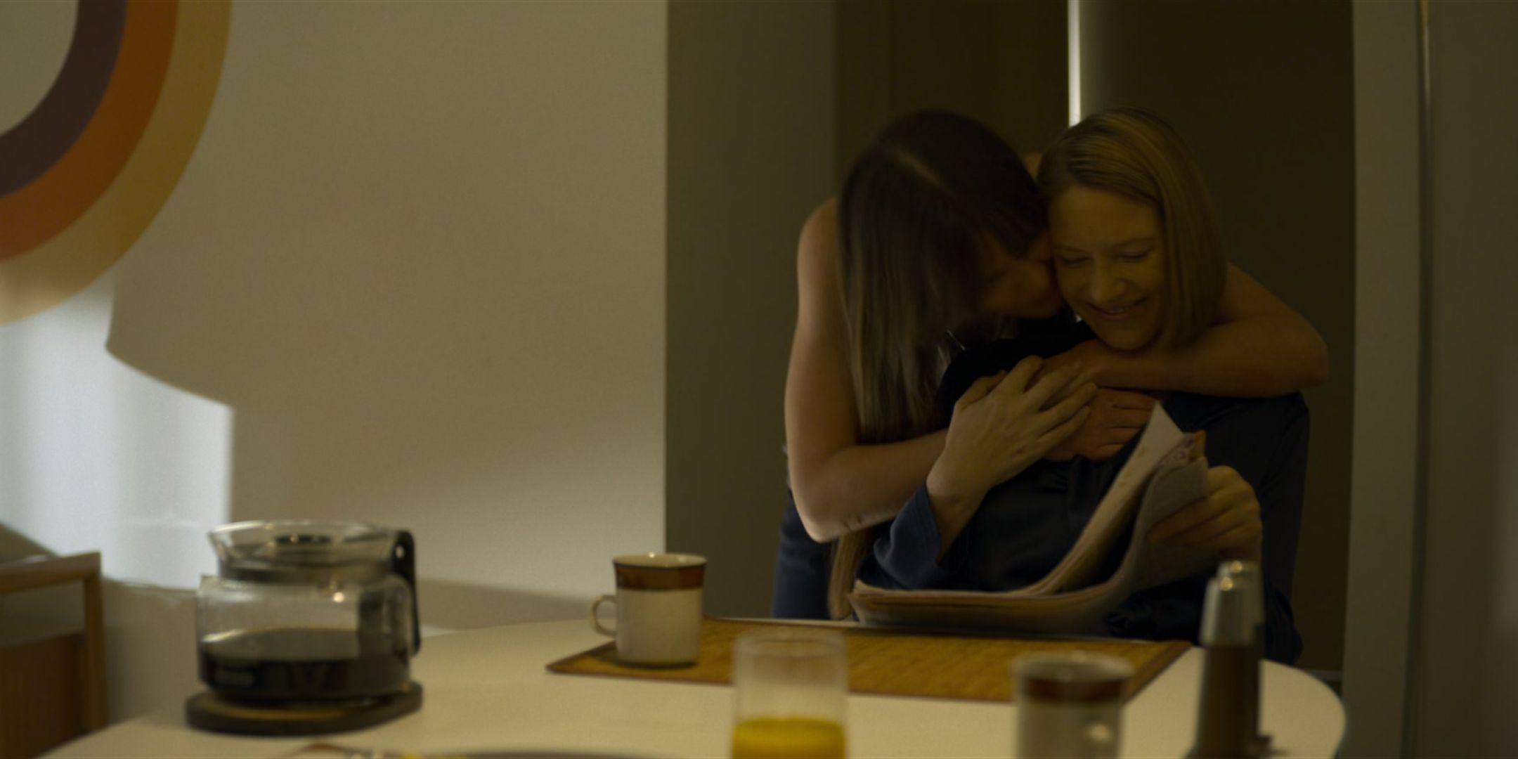 Lauren Glazier as Kay Manz hugs a smiling Anna Torv as Wendy Carr in Mindhunter