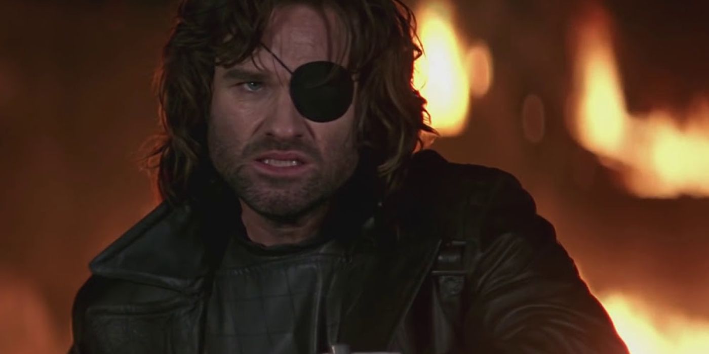 Snake Plissken glares as he emerges from the burning wreckage in Escape From LA