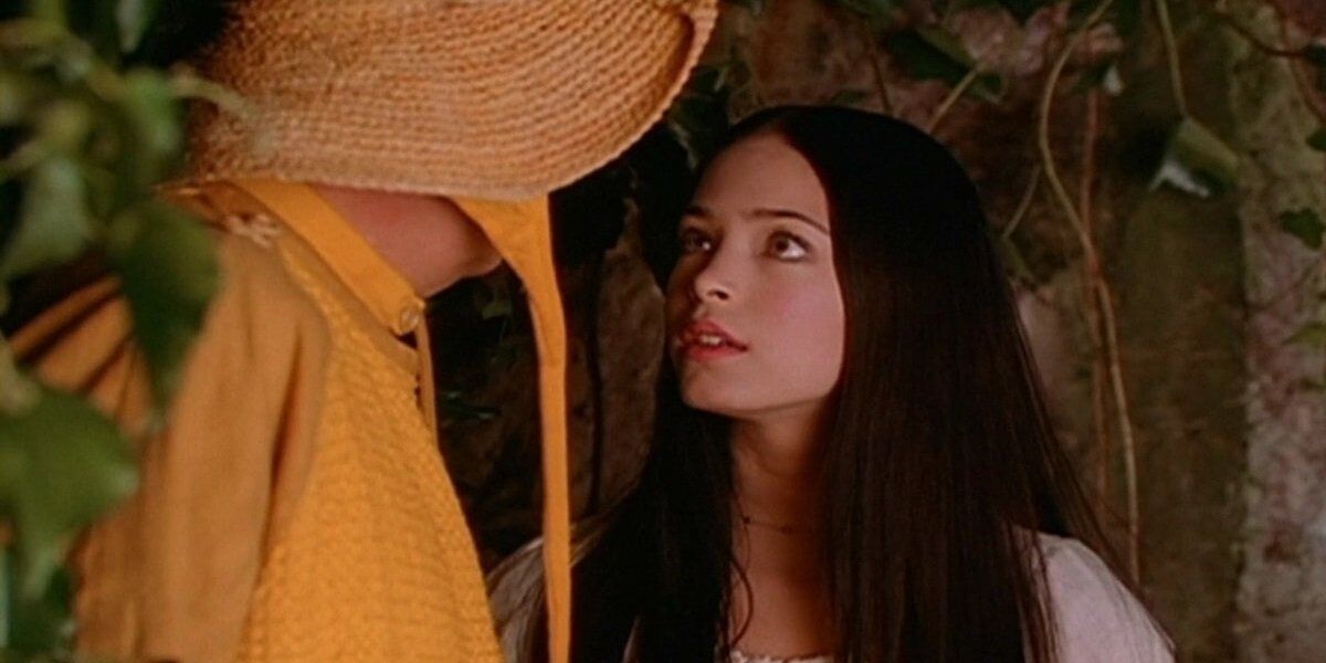 Kristin Kreuk as Snow White looking up at the Huntsman from Snow White: The Fairest of Them All (2001)