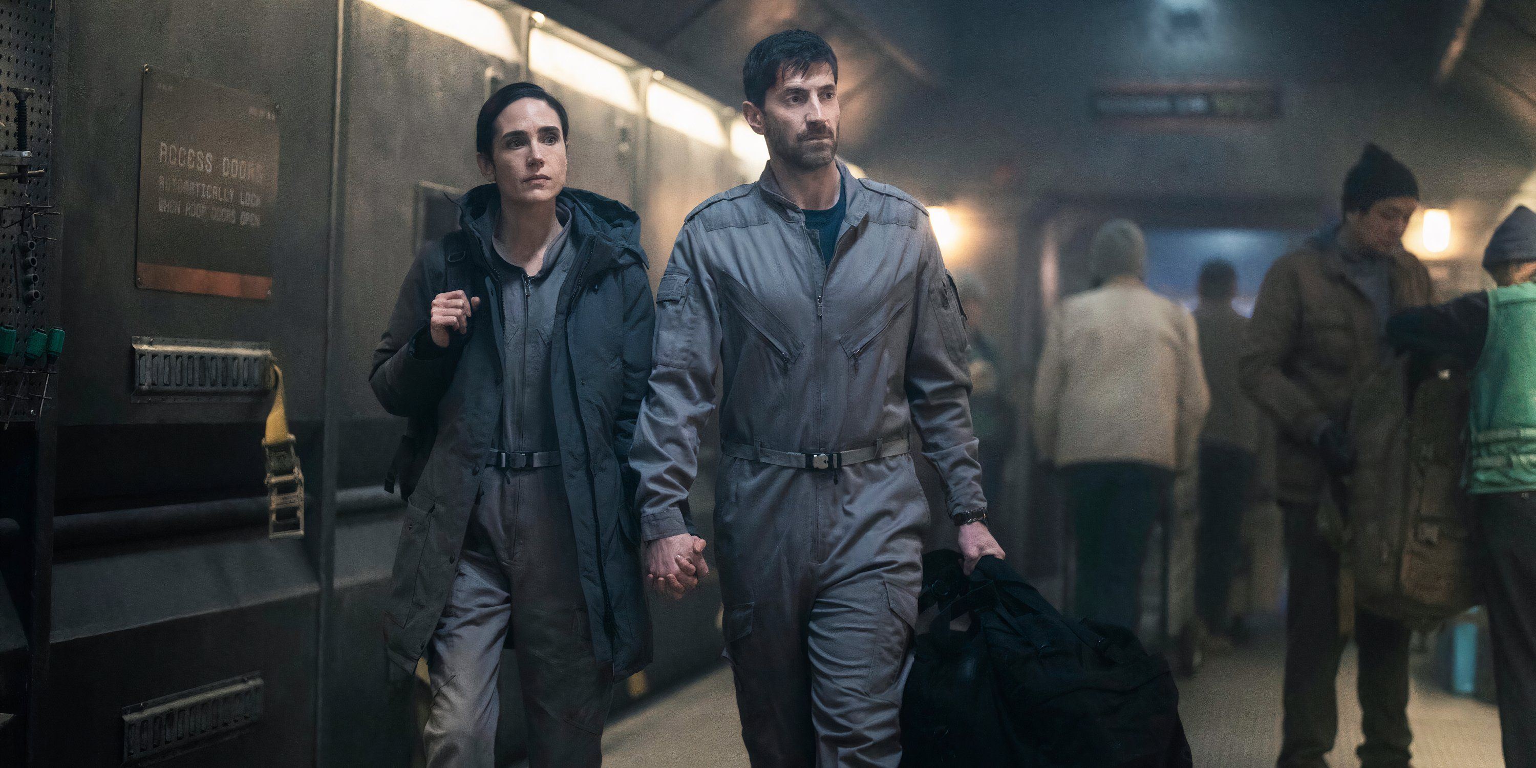 Ben and Melanie walk together in Snowpiercer