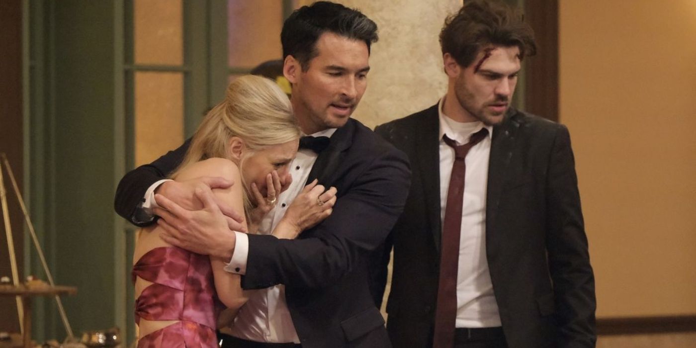 Tricia O'Kelley as Kitty Dixon cries in the arms of Jay Hayden as Travis Montgomery while he and Grey Damon as Jack Gibson look down at the floor collapse on Station 19