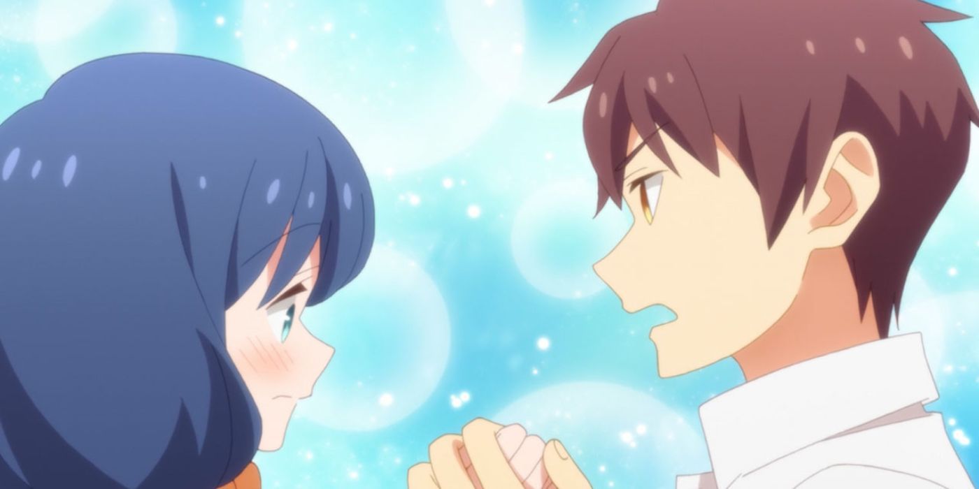 Ayaka and Goda holding hands and looking at each other against a blue bubbly background.