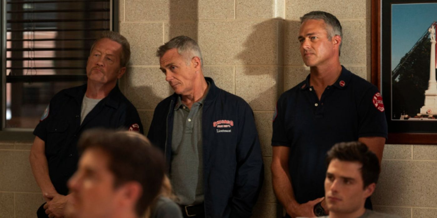 Christian Stolte as Randall 'Mouch' McHolland, David Eigenberg as Christopher Herrmann, and Taylor Kinney as Kelly Severide stand together against a wall in the firehouse on Chicago Fire