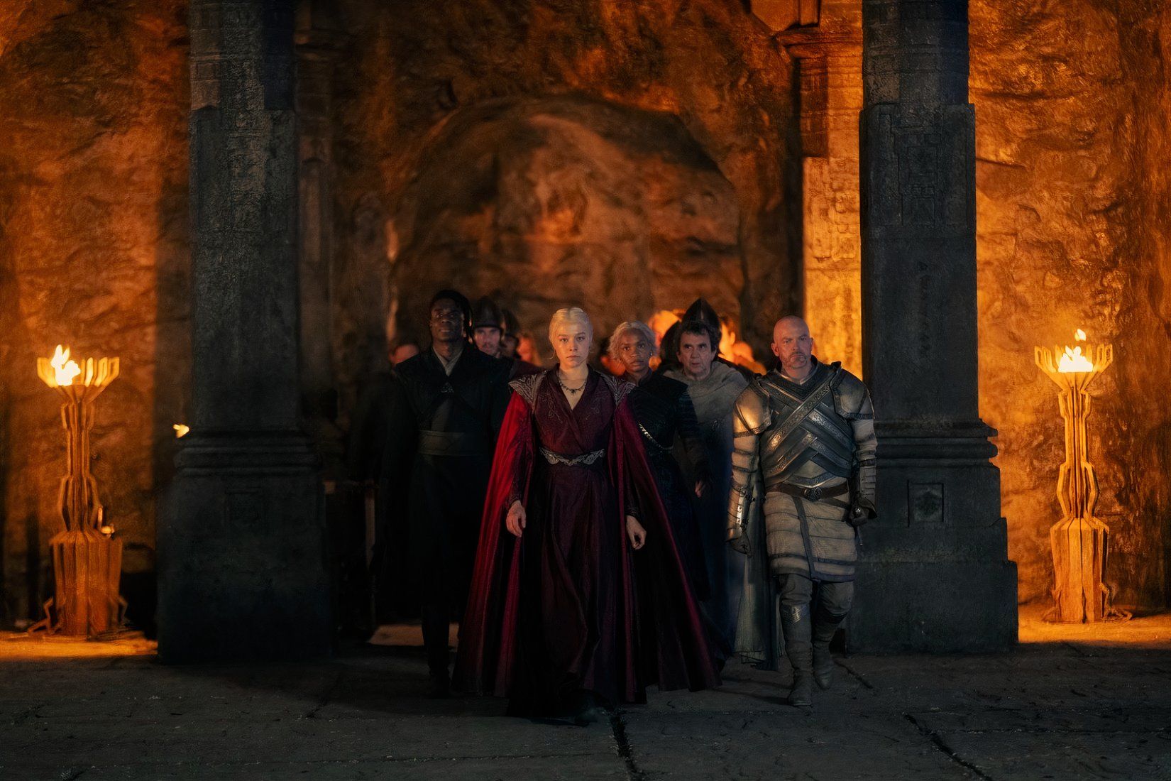 Rhaenyra walks ahead of the Dragonseeds into the Dragonpit