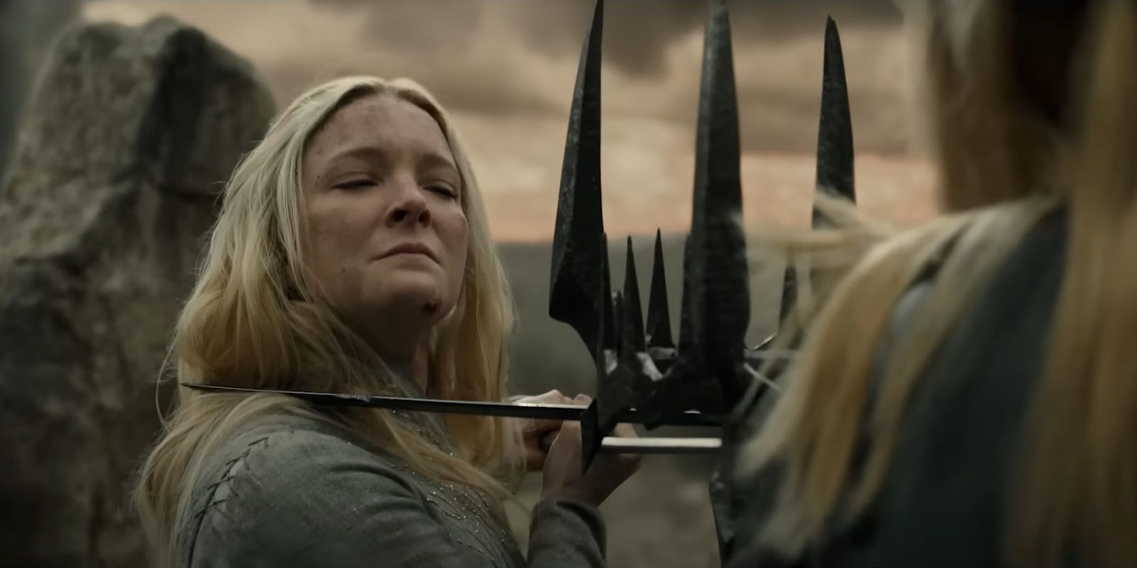 Galadriel looking at Sauron holding Morgoth's crown in The Lord of the Rings: The Rings of Power