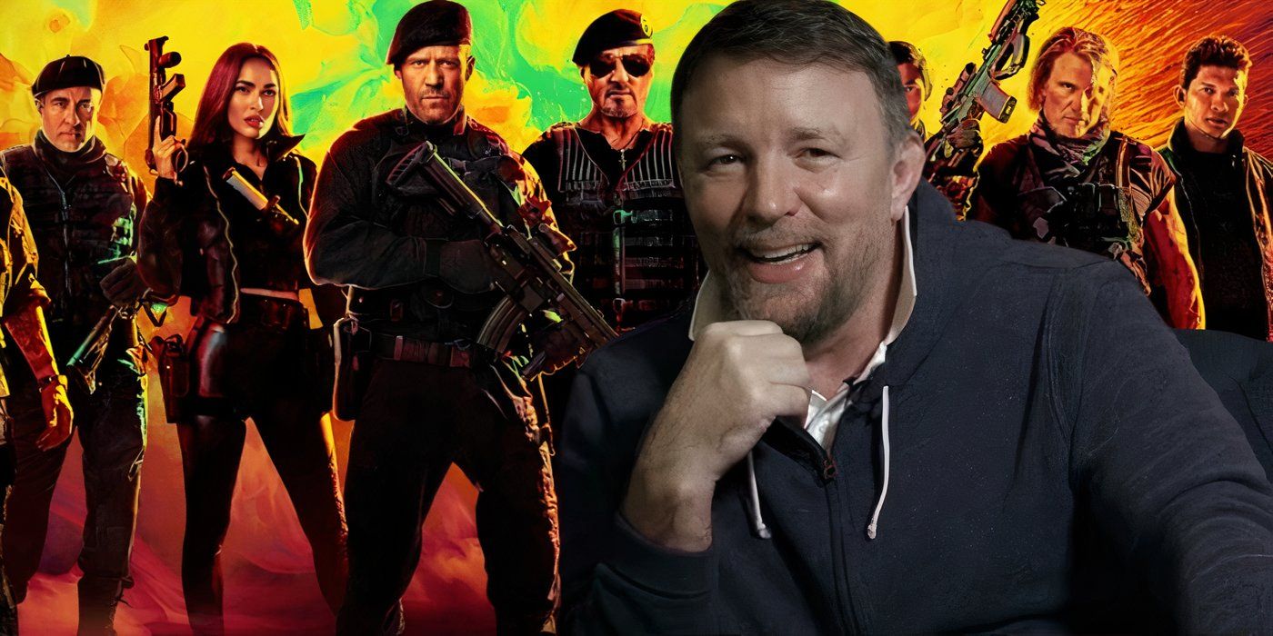 Guy Ritchie in front of a promo image for Expend4bles.