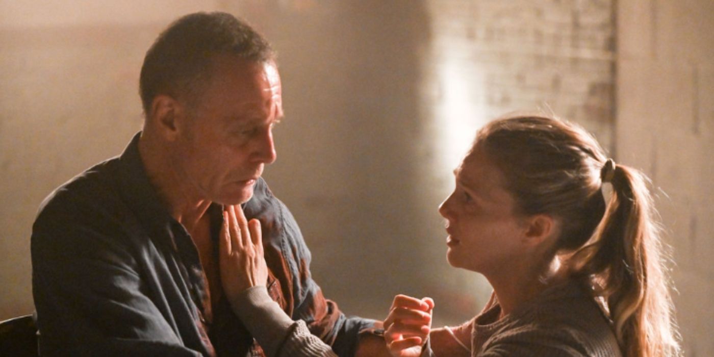 Jason Beghe as Hank Voight cries while trying to push Tracy Spiridakos as Haley Upton away from him on Chicago PD