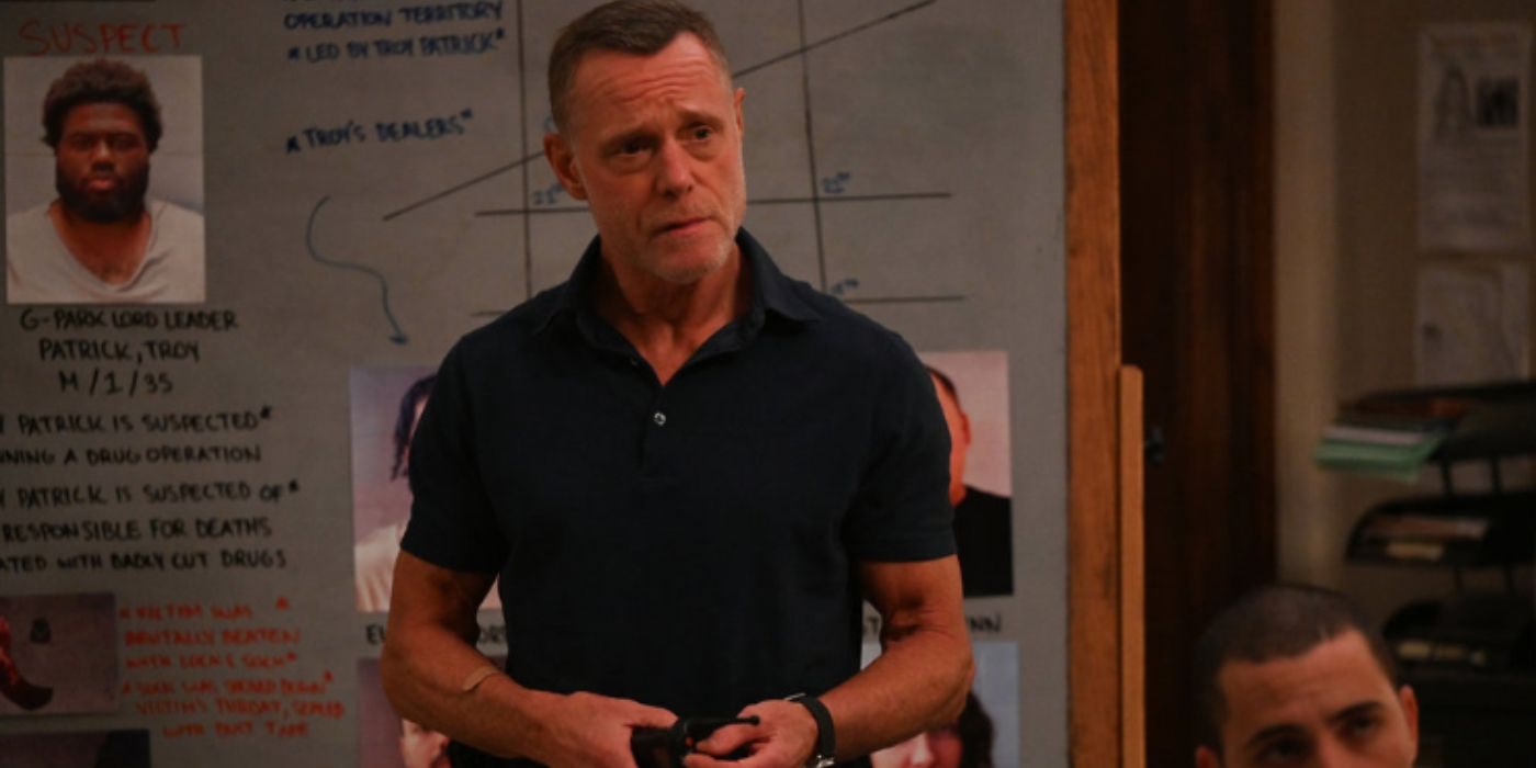 Jason Beghe as Hank Voight stands in front of a chalkboard with case information on it on Chicago PD