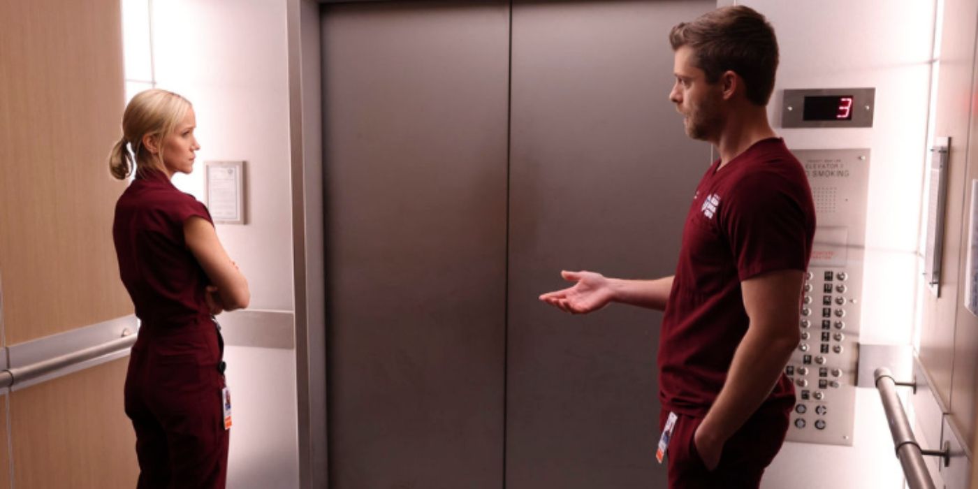 Jessy Schram as Hannah Asher talks with Luke Mitchell as Mitch Ripley in an elevator on Chicago Med