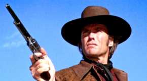 Joe Kidd points his gun upwards in Joe Kidd.