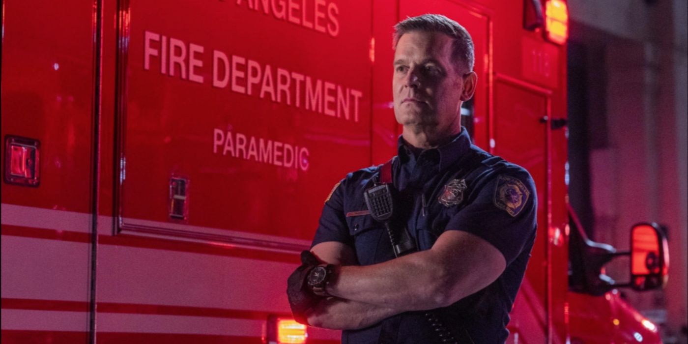 Peter Krause as Bobby Nash stands with his arms crossed in front of the 118's ambulance on 9-1-1