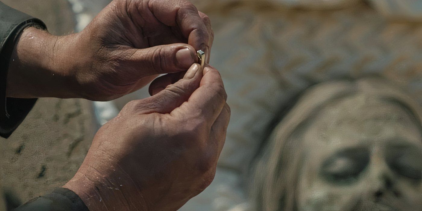 Rip holds his mother's ring after digging up her body.