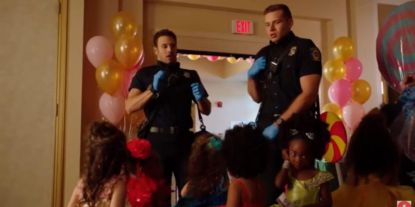 Ryan Guzman as Eddie Diaz and Oliver Stark as Evan 'Buck' Buckley look startled by several young girls as beauty queens on 9-1-1