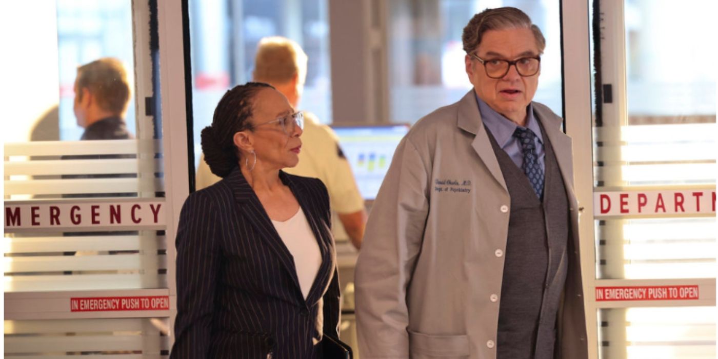 S. Epatha Merkerson as Sharon Goodwin walks into the emergency department with Oliver Platt as Daniel Charles on Chicago Med