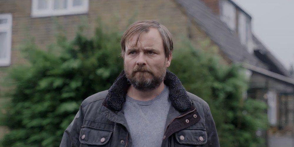 Neil Maskell as Bull walking ominously