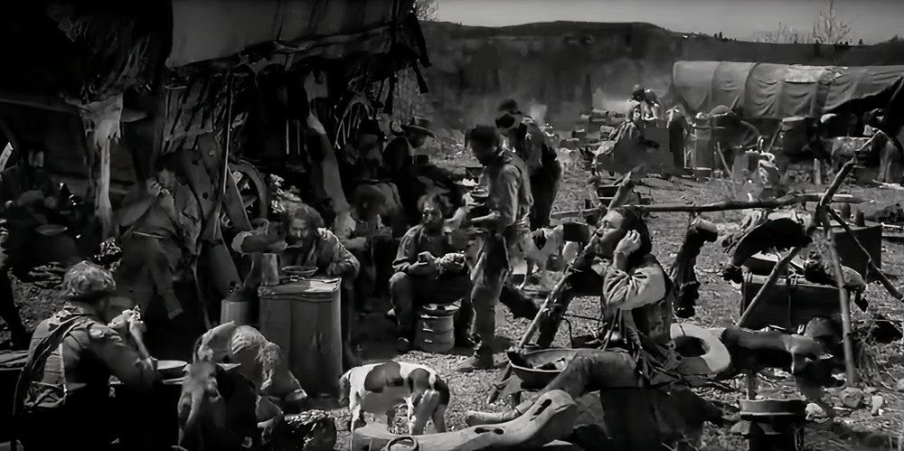 A crowd of travelers in The Big Trail