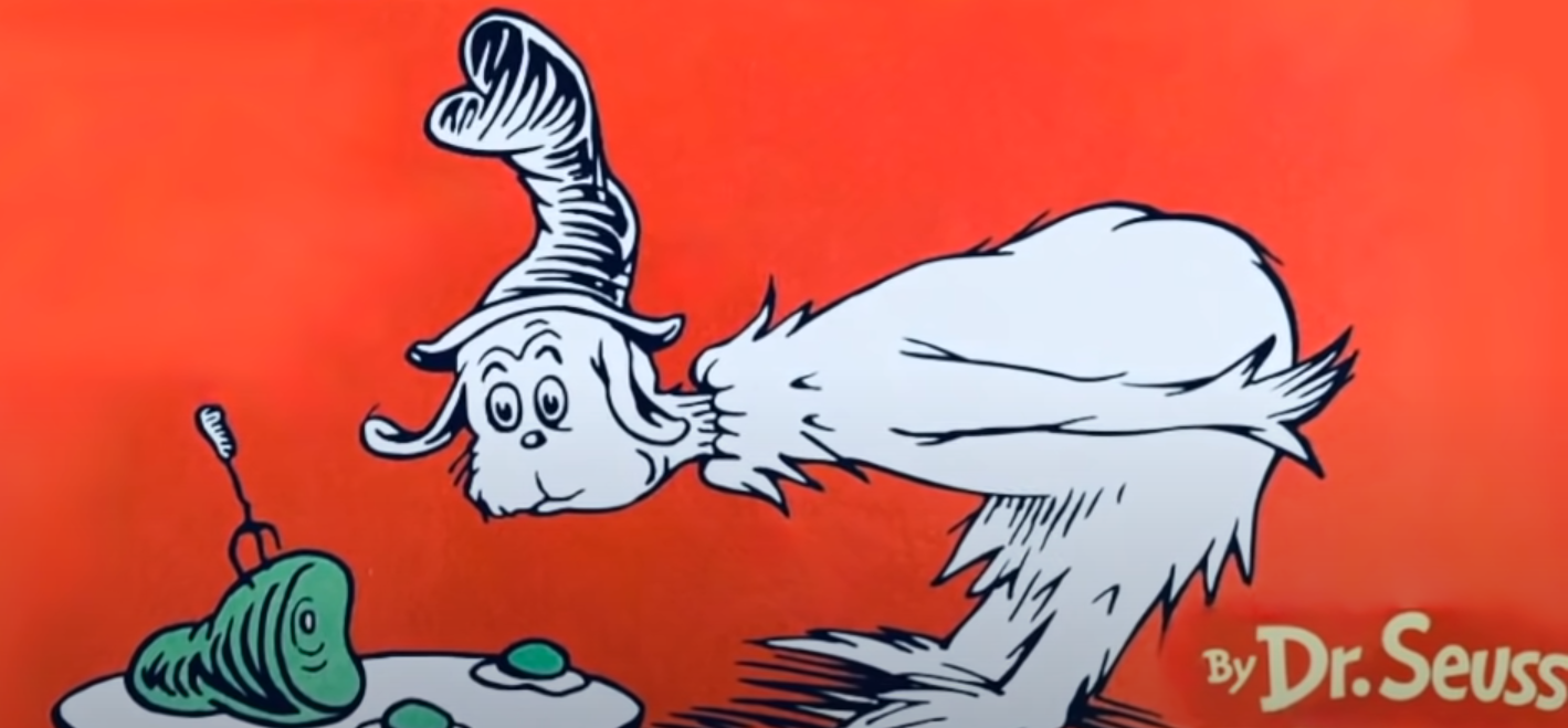 O homem não identificado inspeciona um prato de ovos verdes e presunto do Dr. Seuss.