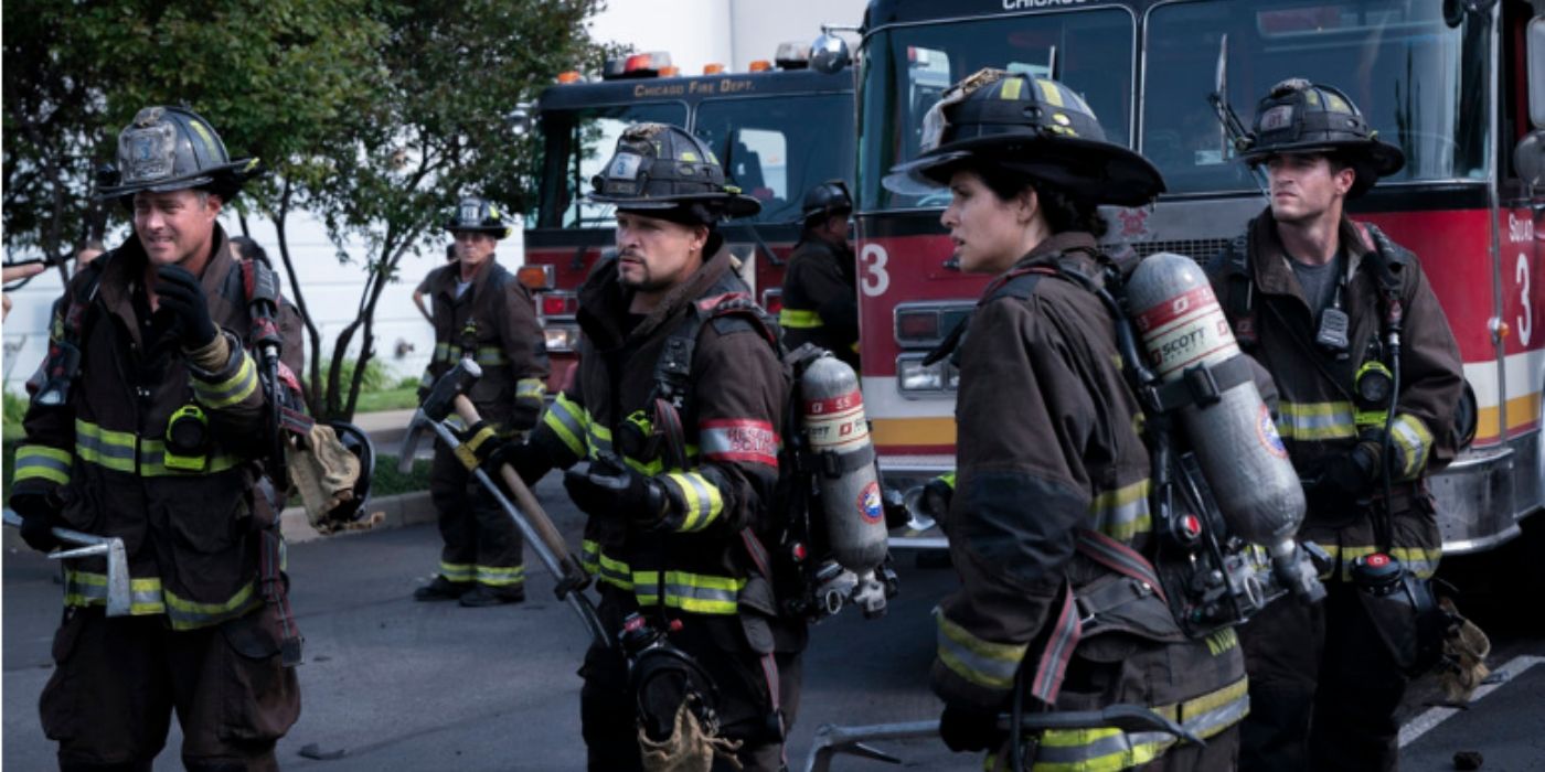 Taylor Kinney as Kelly Severide, Joe Minoso as Joe Cruz, Miranda Rae Mayo as Stella Kidd, and Jake Lockett as Sam Carver stands together in their turnout gear on Chicago Fire