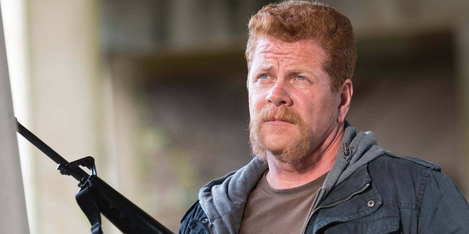 Abraham looking ahead with a rifle in his hand in The Walking Dead.