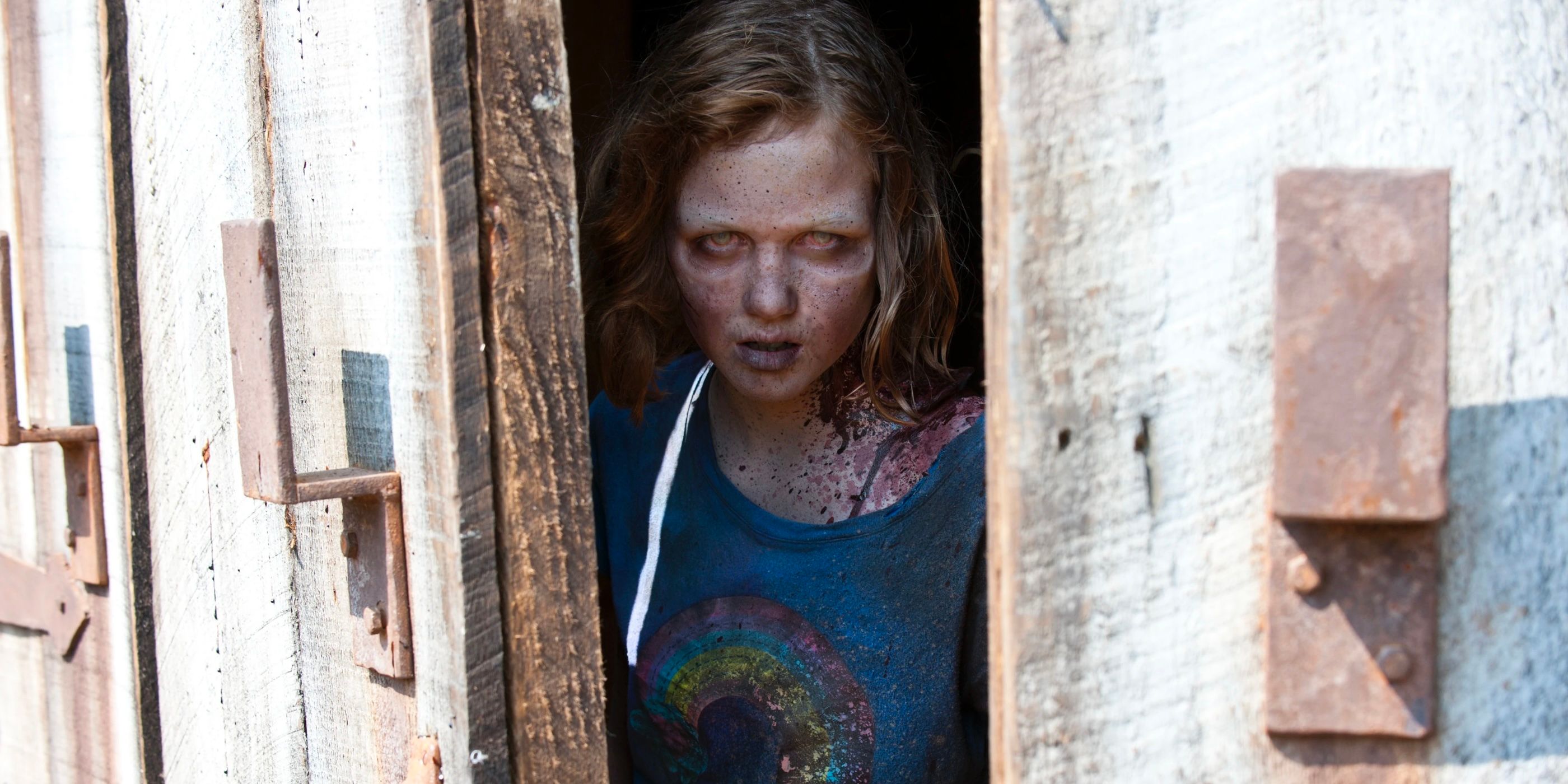 Sophia Peletier walking out of a barn as a walker on The Walking Dead