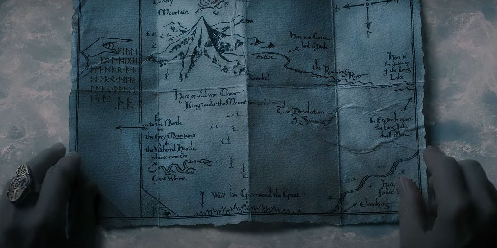 Elrond's hands on Thror's map from The Hobbit: An Unexpected Journey