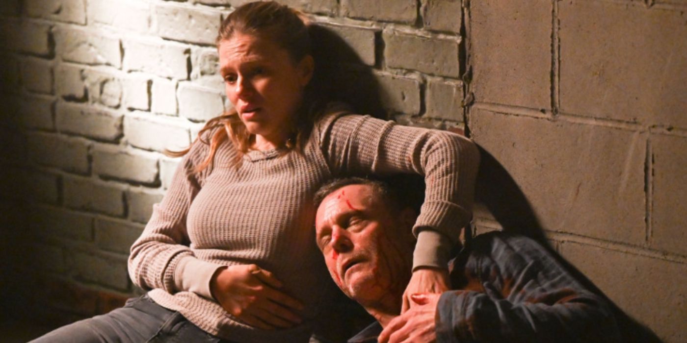 Tracy Spiridakos as Haley Upton holds her side and comforts Jason Beghe as Hank Voight as he leans against her on Chicago PD