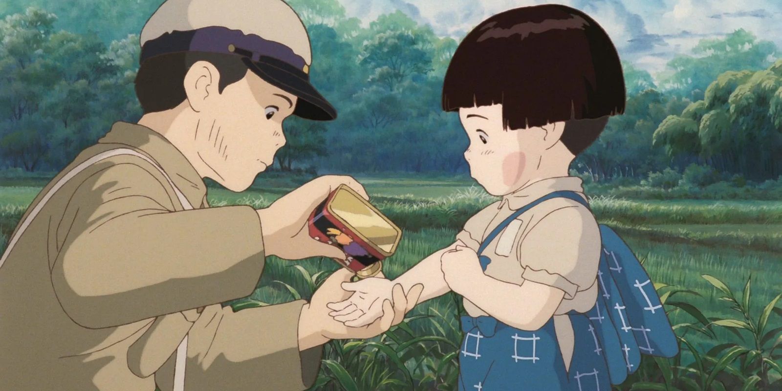 Studio Ghibli's Grave of the Fireflies screenshot shows Seita giving Setsuko Sakuma Drops candy