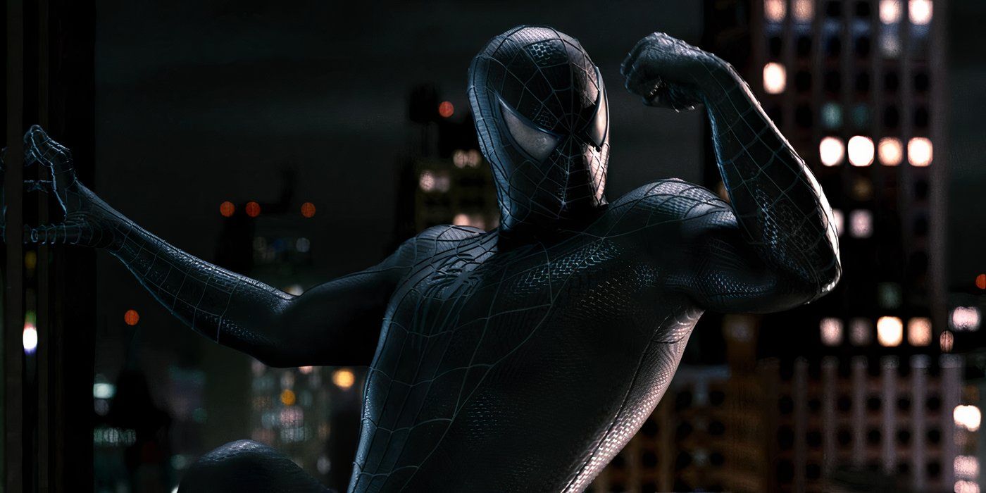 Venom shows off his muscles while hanging off the side of a building in Spider-Man 3