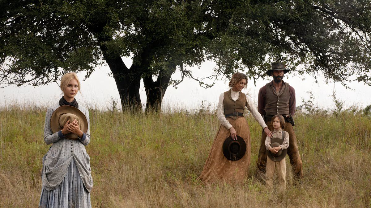 Tim McGraw as John Dutton, Faith Hill as Margaret Dutton and Isabel May as Elsa Dutton getting ready to join a group of people going west in 1883.