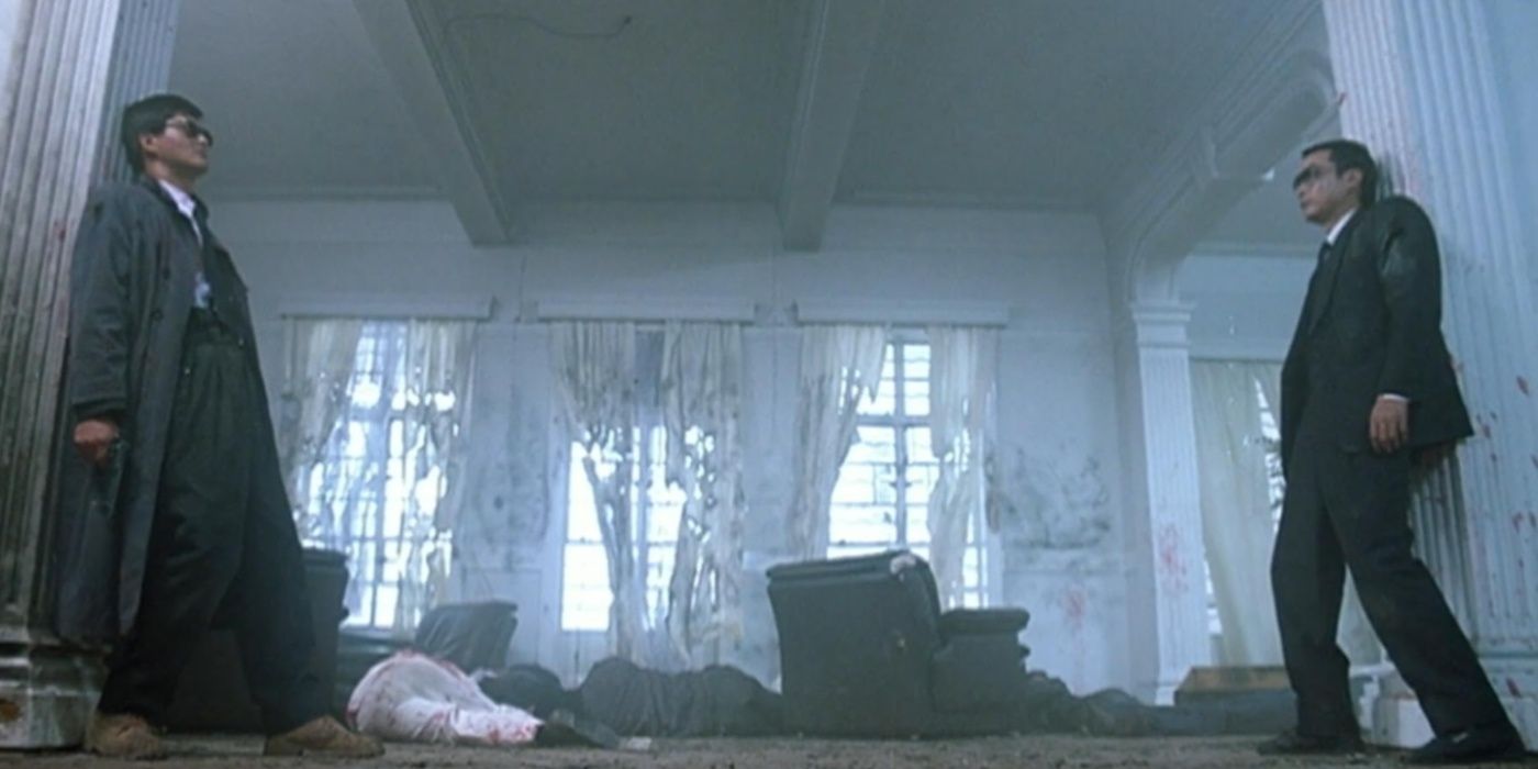 Two men face each other across a destroyed room in A Better Tomorrow II.